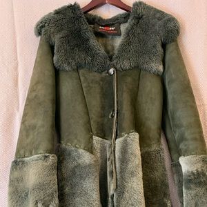 Genuine soft suede winter coat with asymmetrical bottom and sleeves detail.